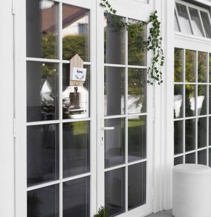 decorated-front-door-with-plant